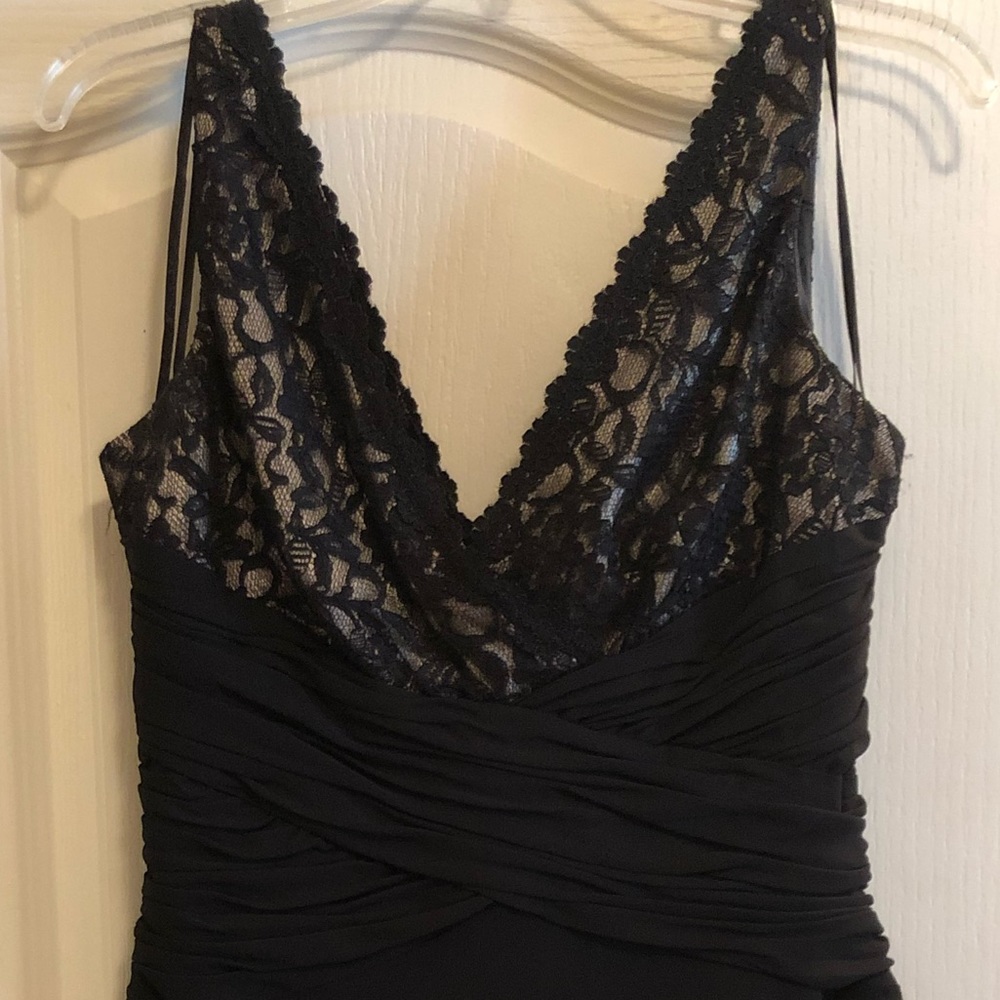 Semi-formal black dress with lace and gold.
